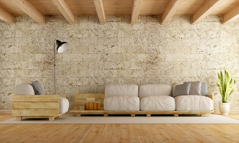 Modern living room with pallet sofa,stone wall and wooden ceiling - 3D Rendering
